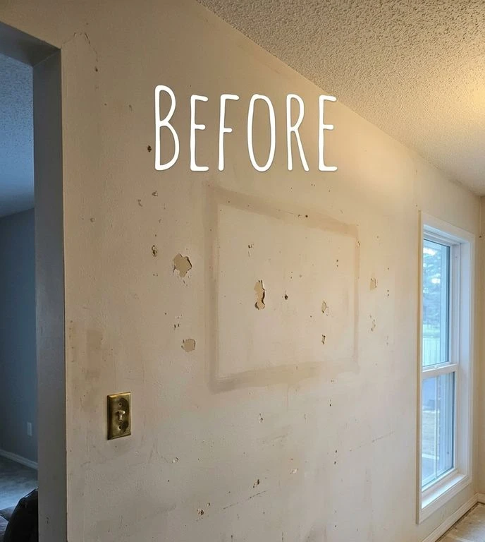 Before: Living room wall with scuffs and settling cracks